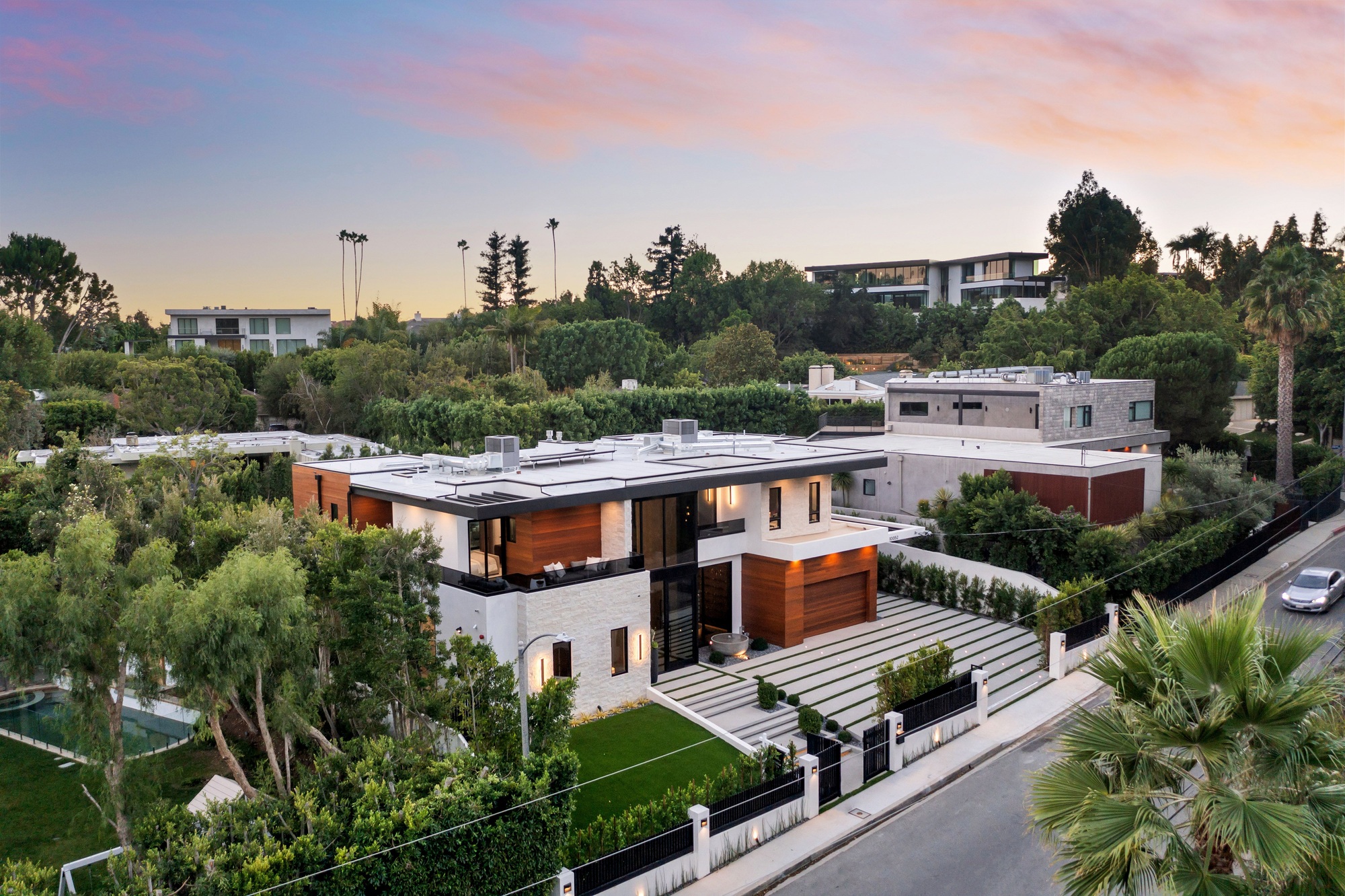 Modern luxury house aerial view at sunset